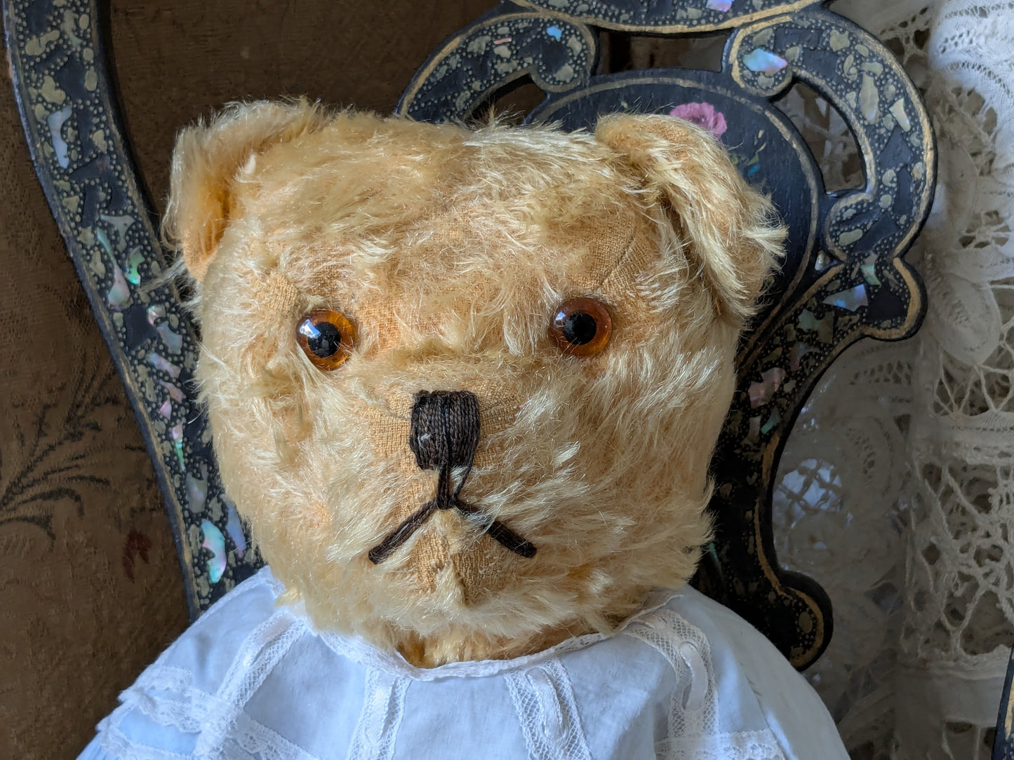 Vintage teddy bear in a cute vintage dress