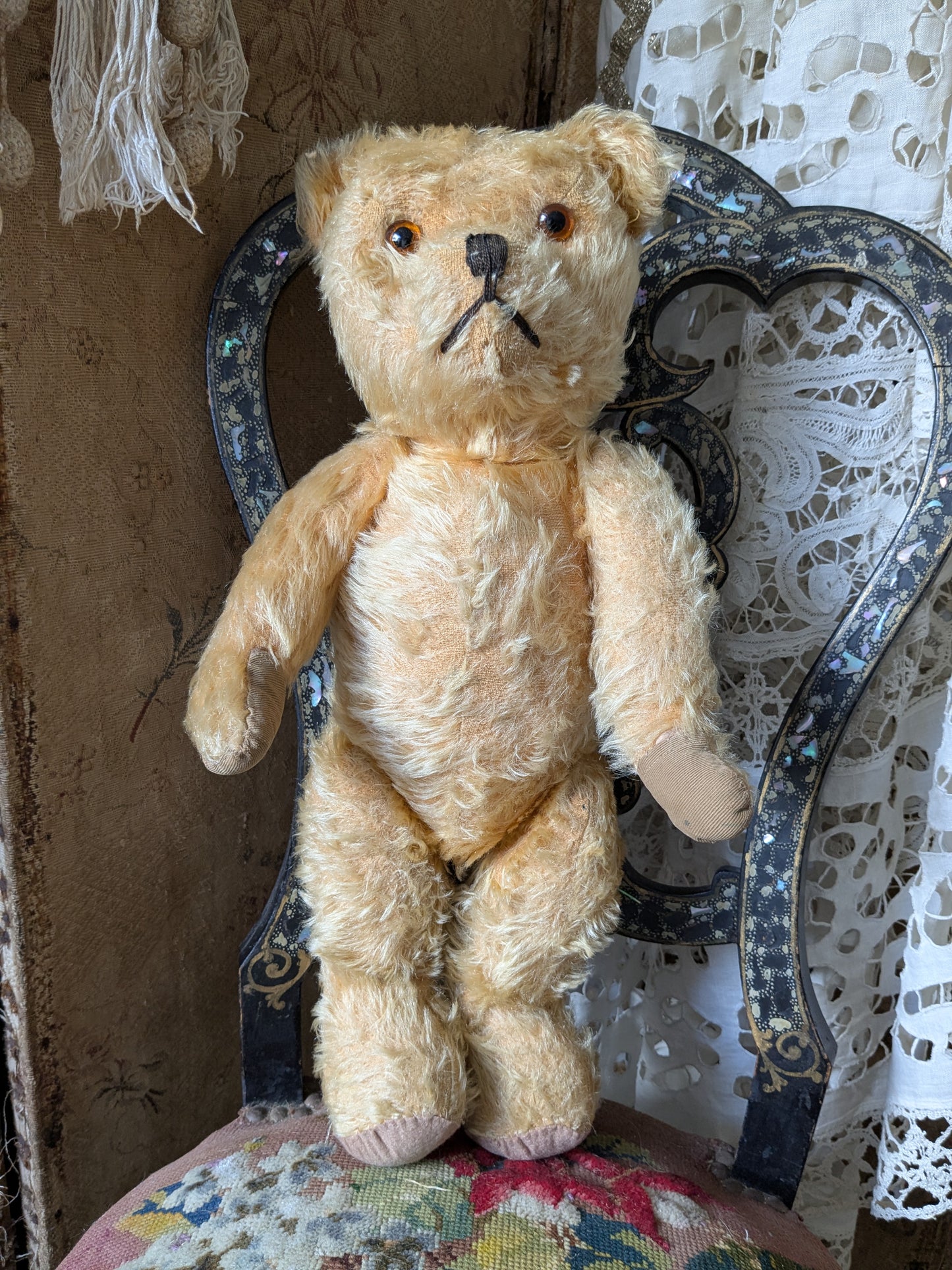 Vintage teddy bear in a cute vintage dress