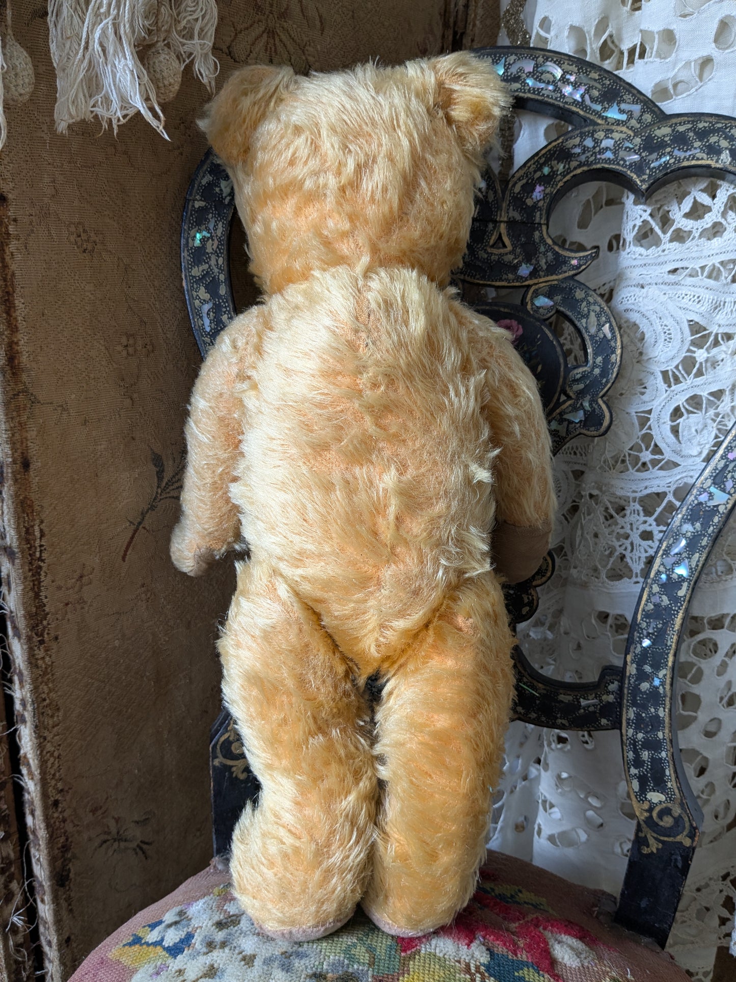 Vintage teddy bear in a cute vintage dress