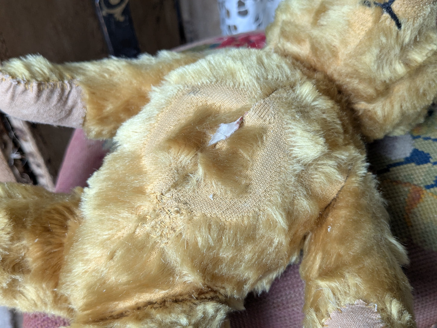 Vintage teddy bear is pretty antique dress