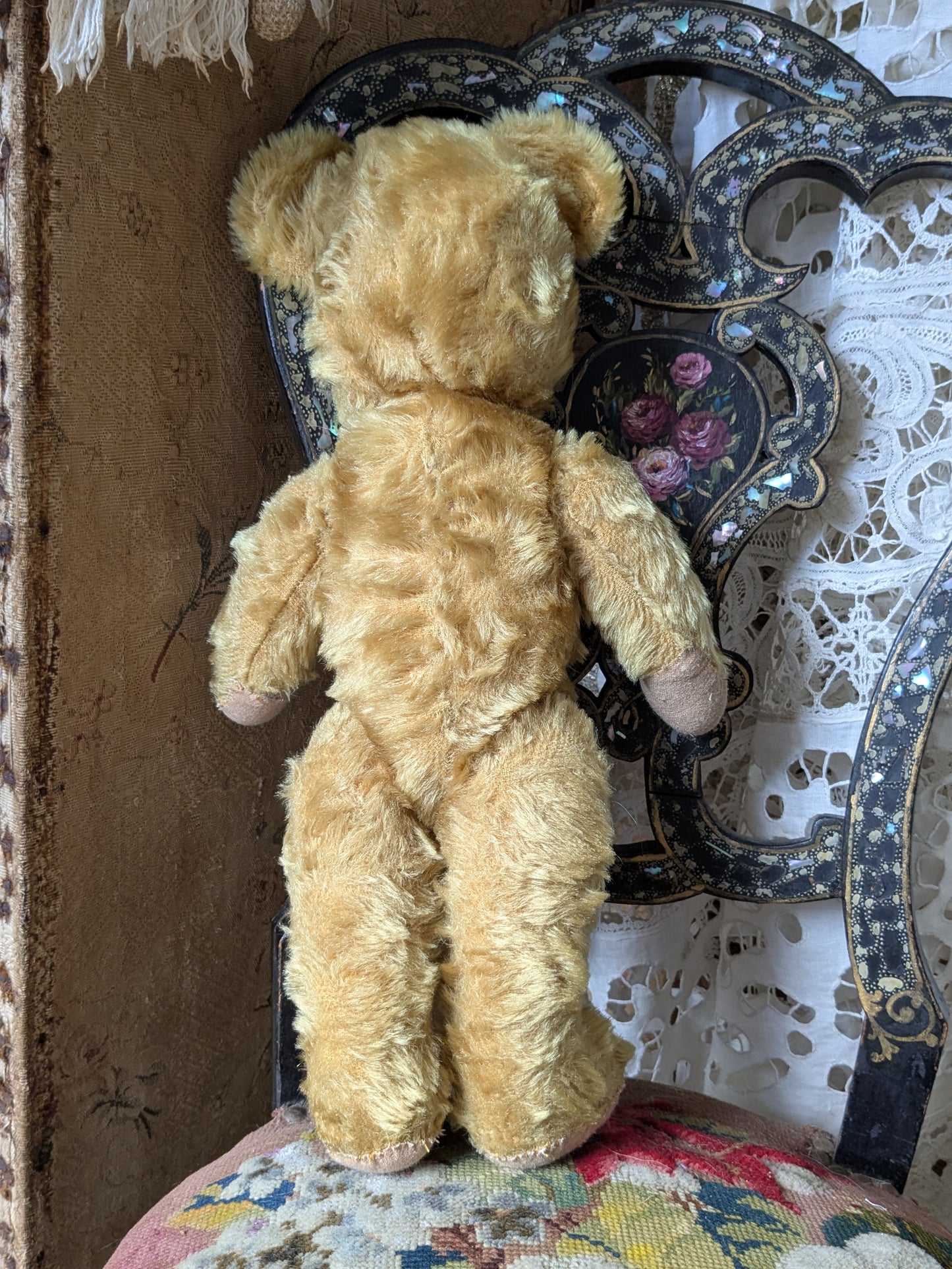 Vintage teddy bear is pretty antique dress