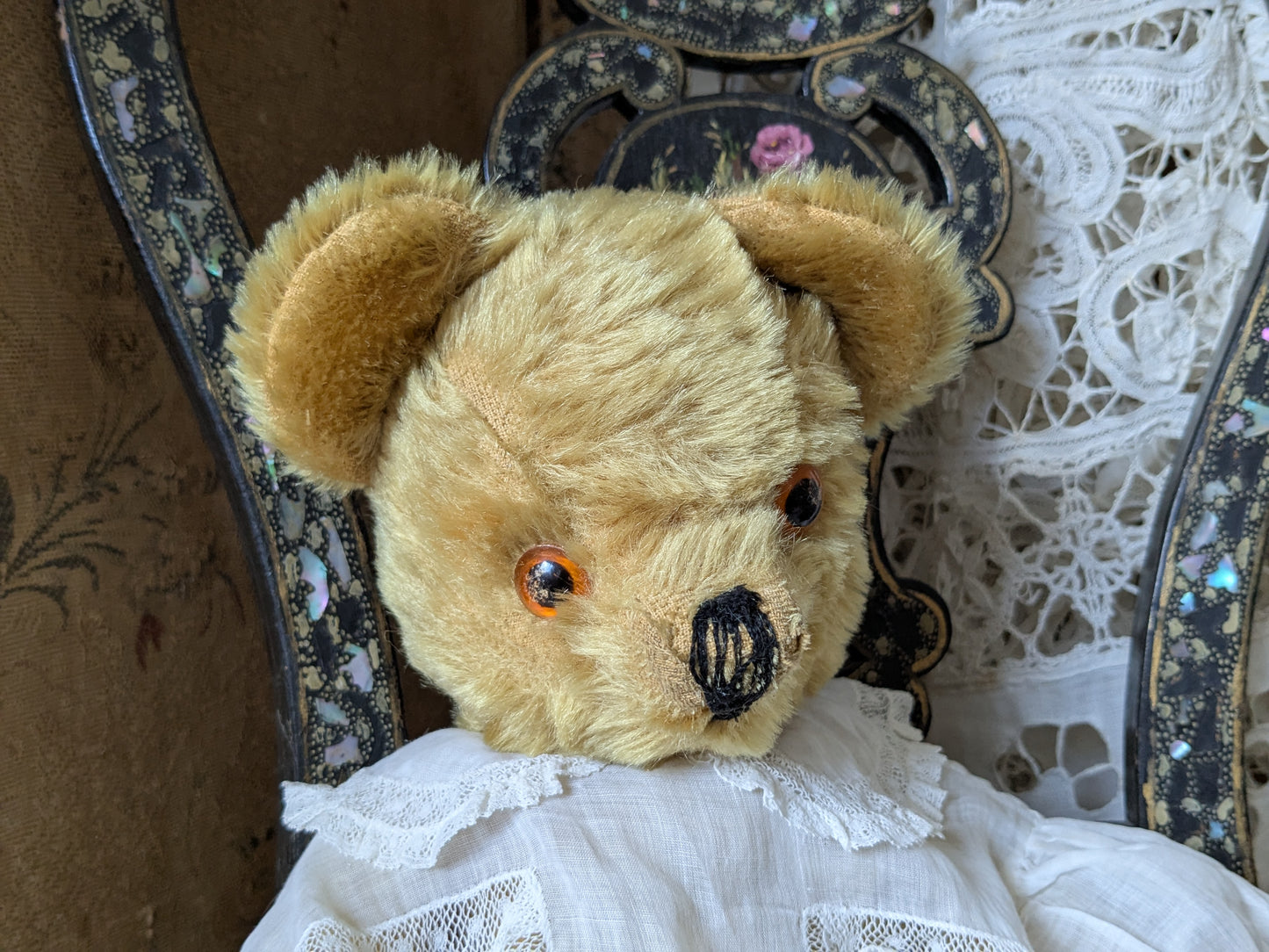 Vintage teddy bear is pretty antique dress