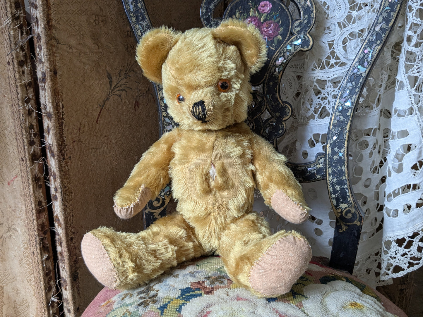 Vintage teddy bear is pretty antique dress