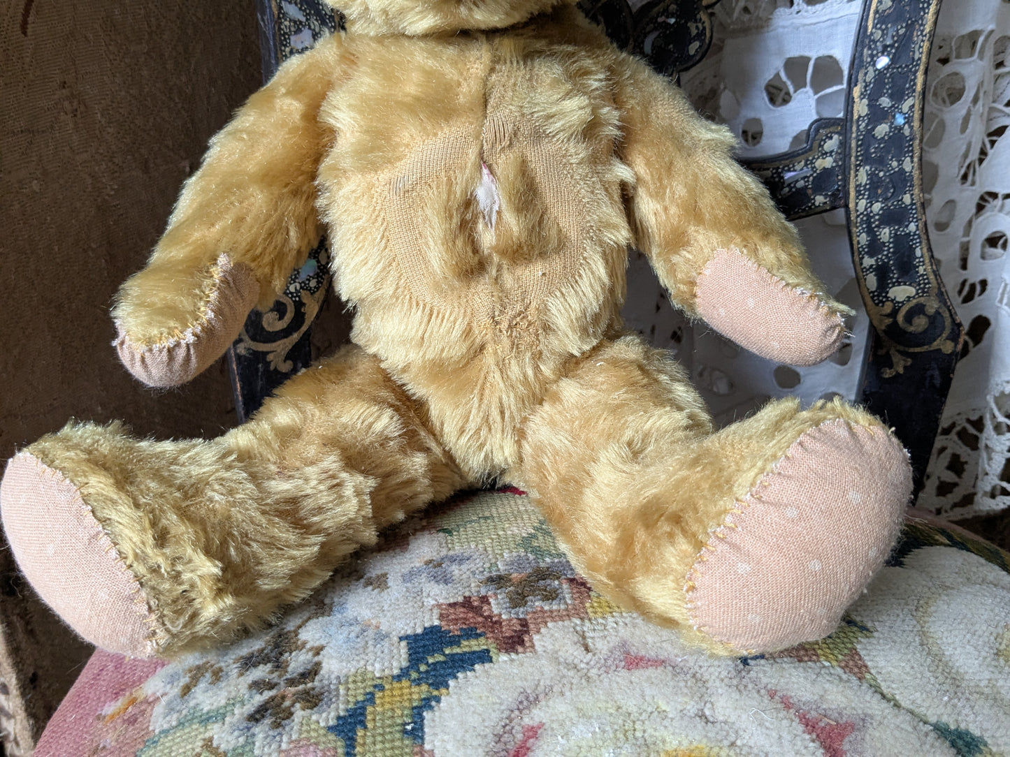 Vintage teddy bear is pretty antique dress