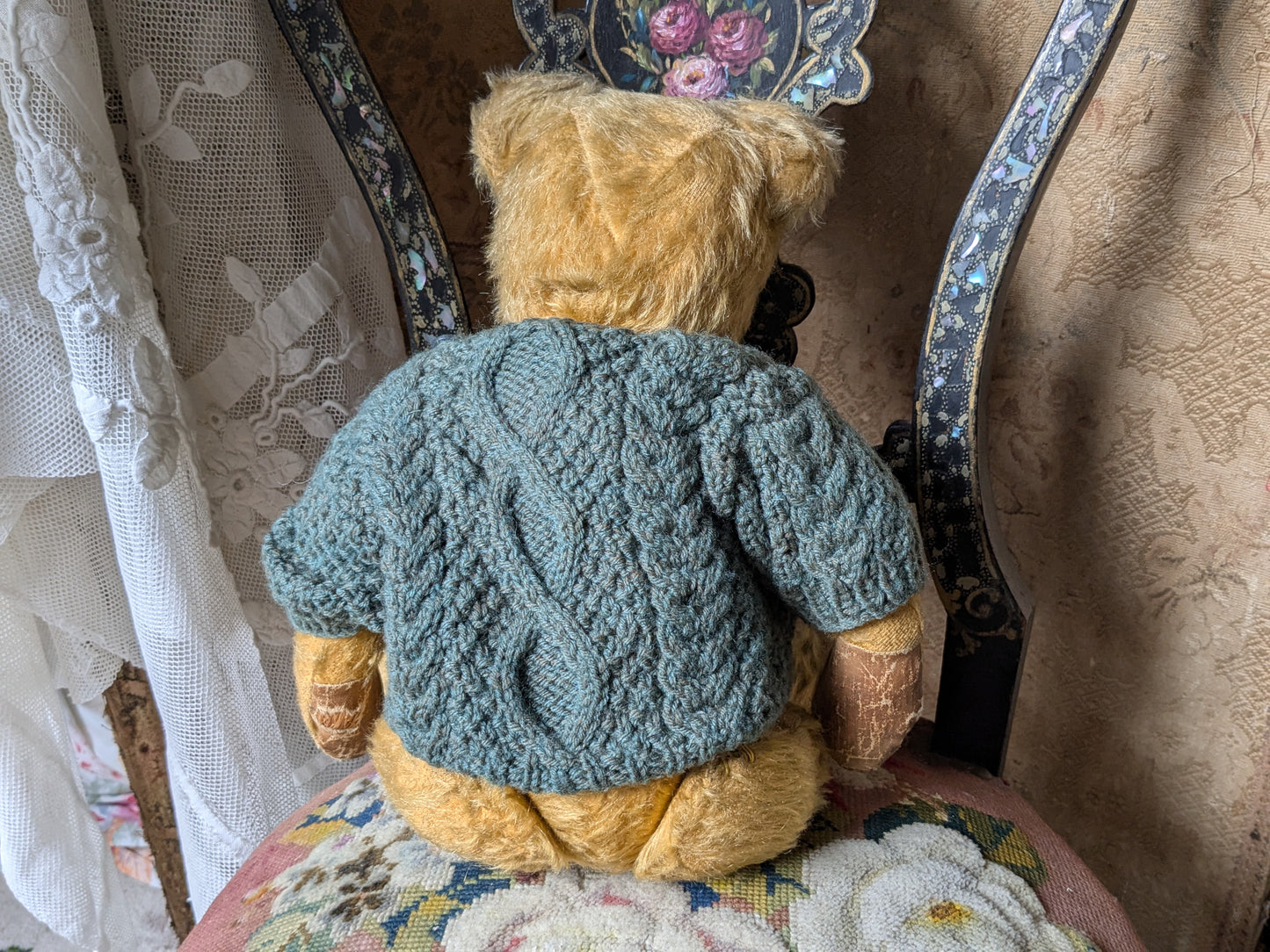 Vintage teddy bear in hand knitted Aran jumper