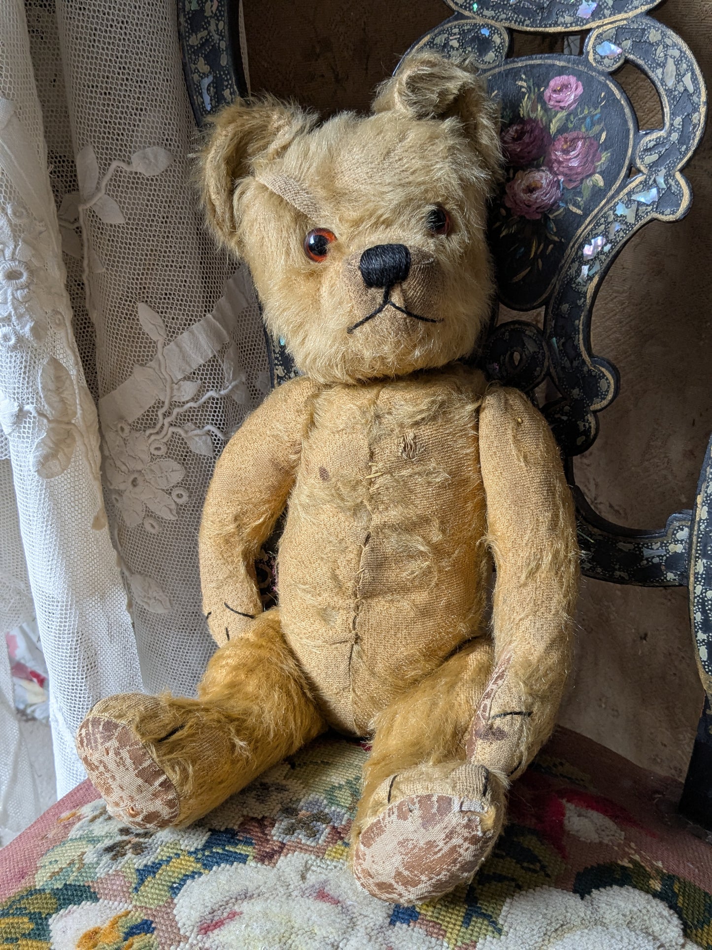 Vintage teddy bear in hand knitted Aran jumper
