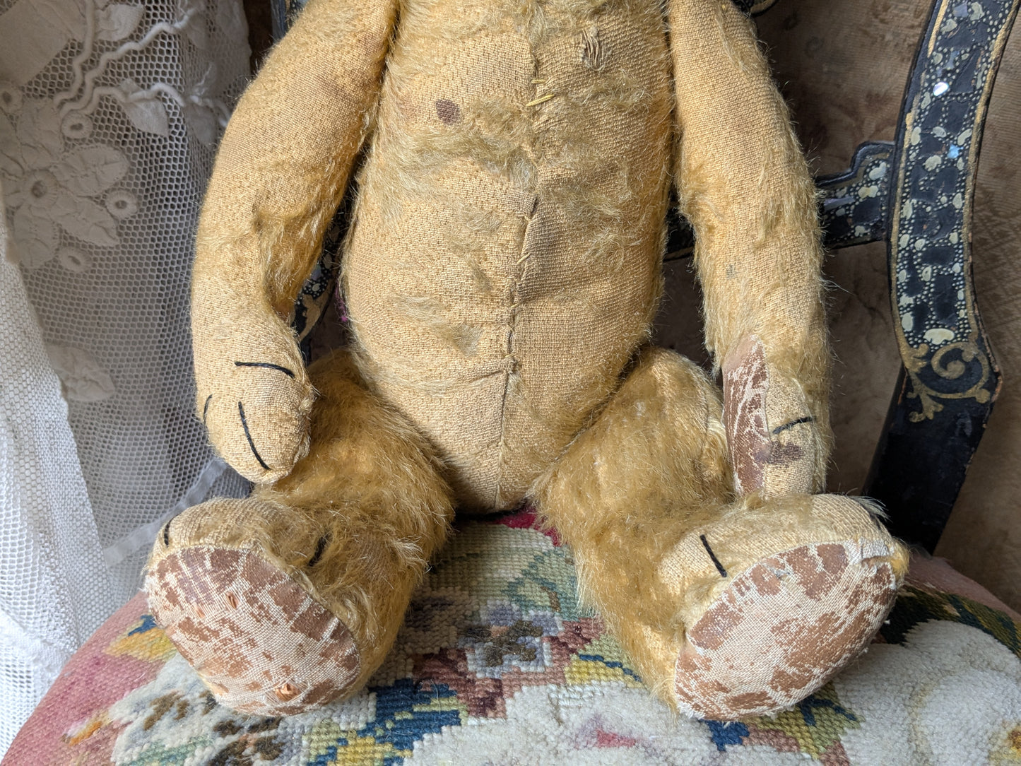 Vintage teddy bear in hand knitted Aran jumper