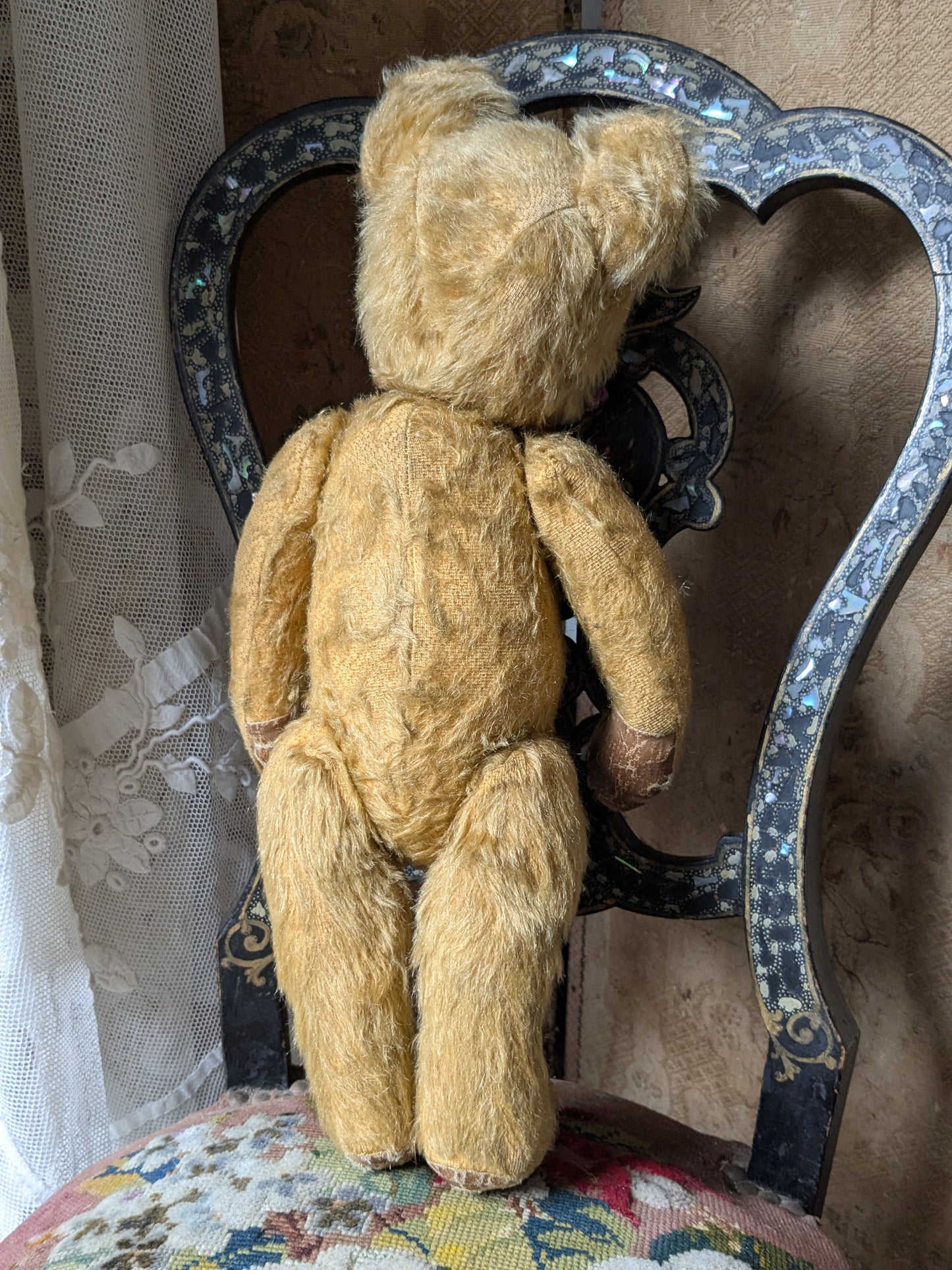 Vintage teddy bear in hand knitted Aran jumper