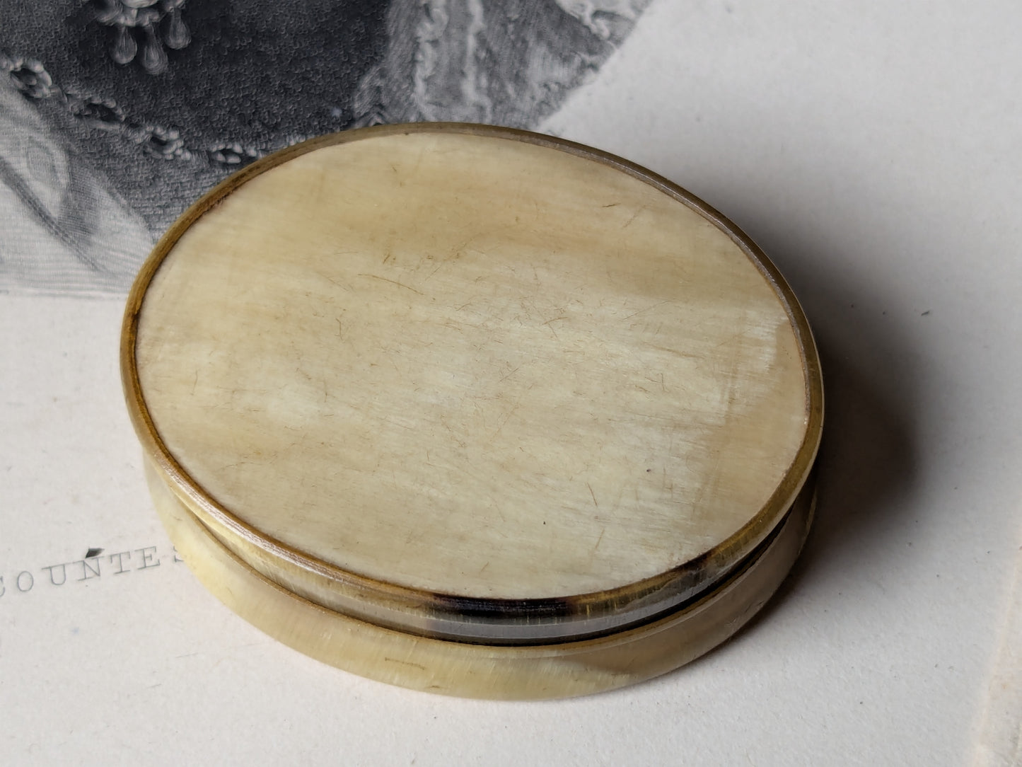 Antique horn snuff box with miniature writing inside