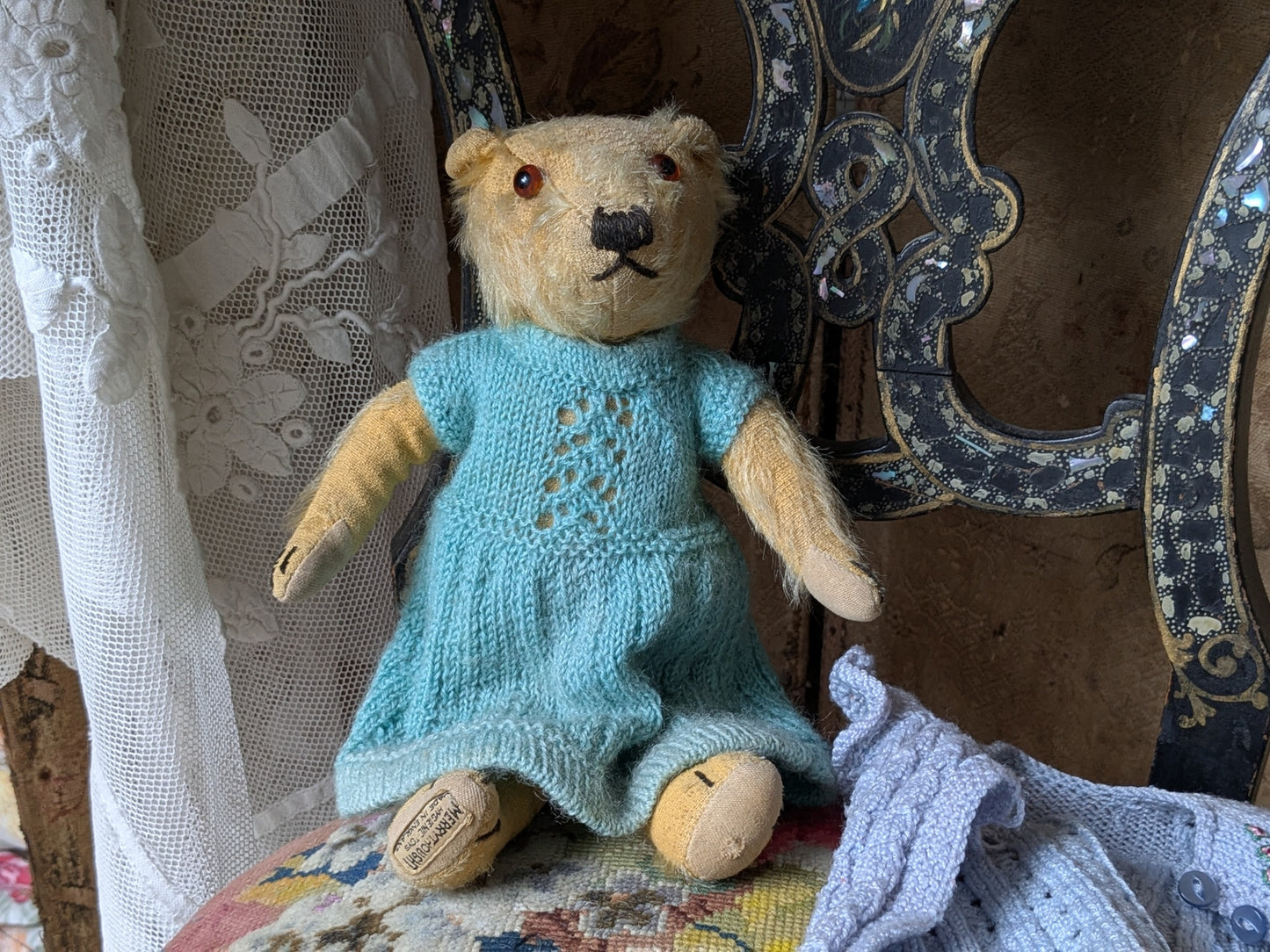 Small vintage Merrythought bear in charming clothes