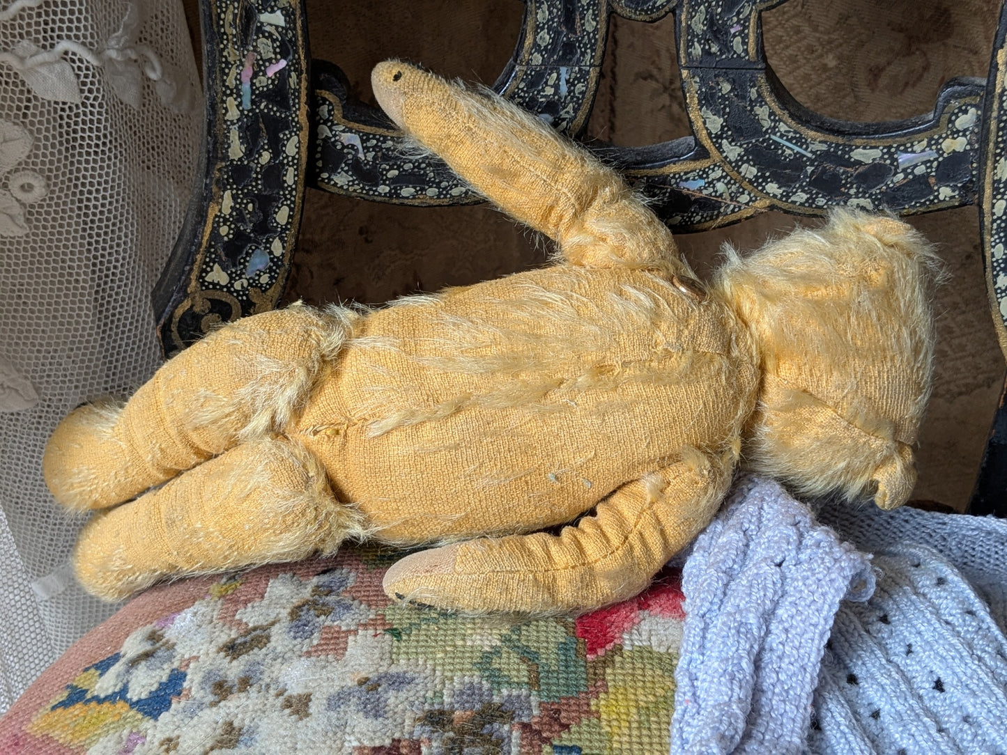 Small vintage Merrythought bear in charming clothes