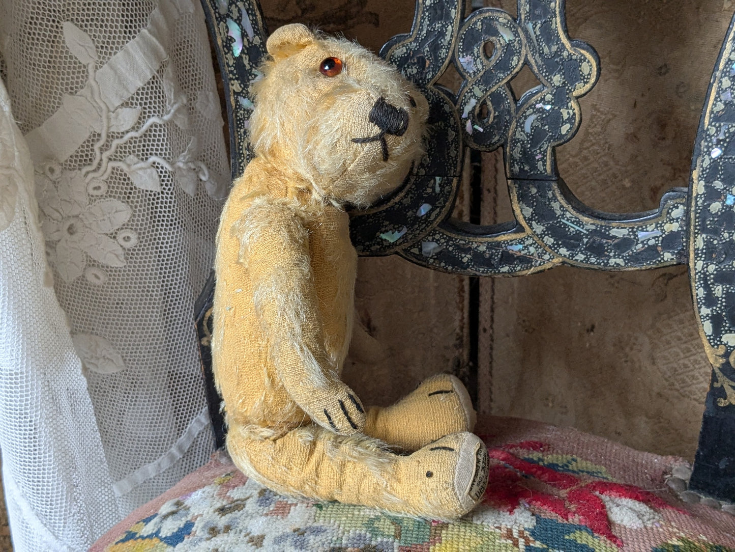 Small vintage Merrythought bear in charming clothes