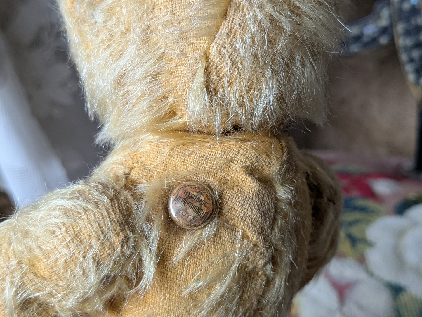 Small vintage Merrythought bear in charming clothes
