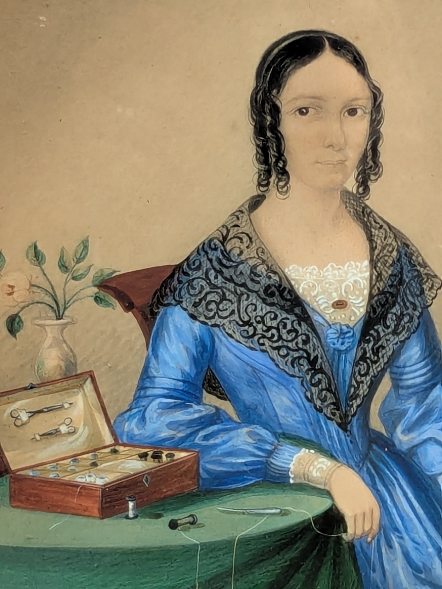 Antique portrait miniature of a lady with her workbox