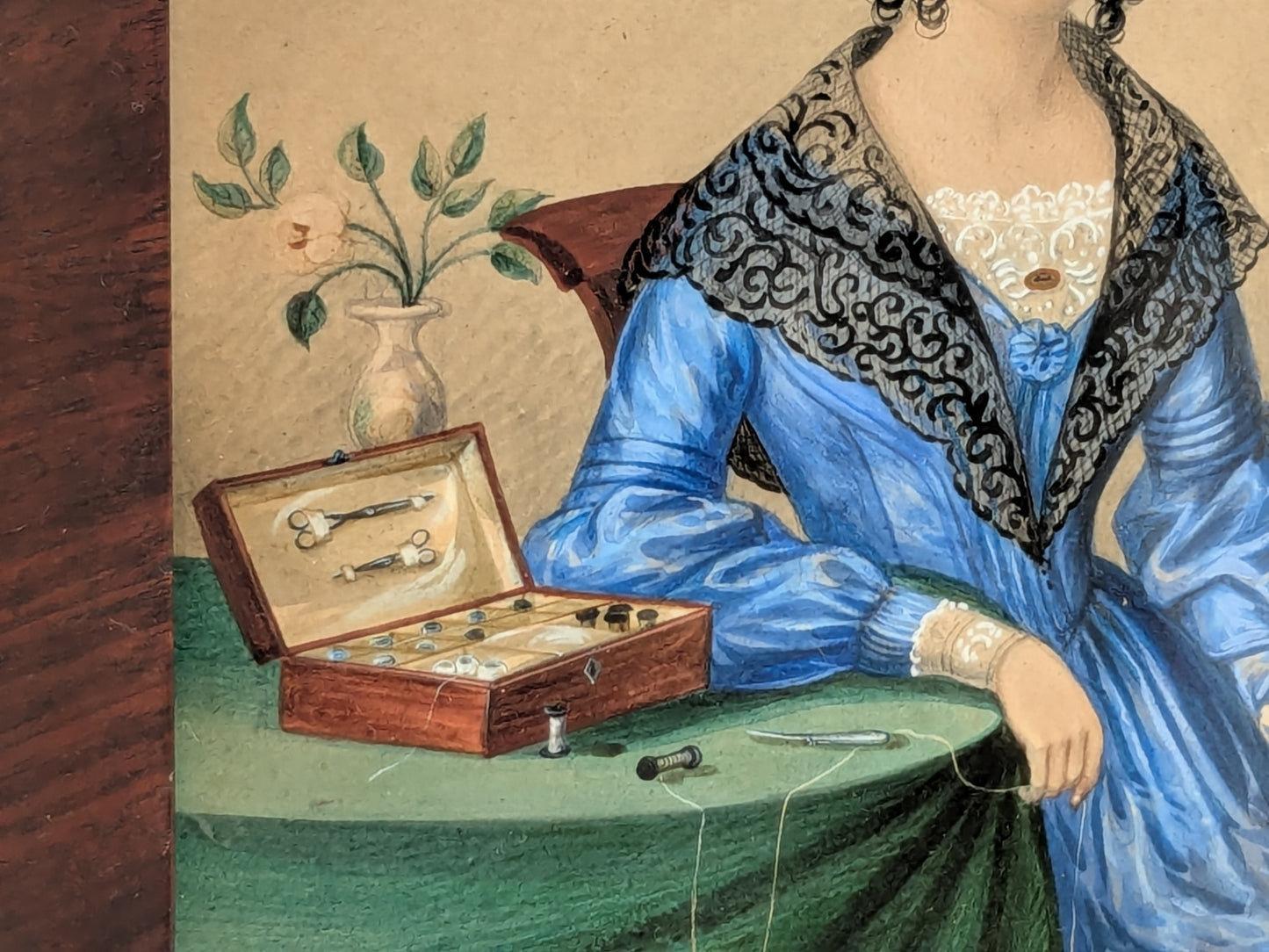 Antique portrait miniature of a lady with her workbox