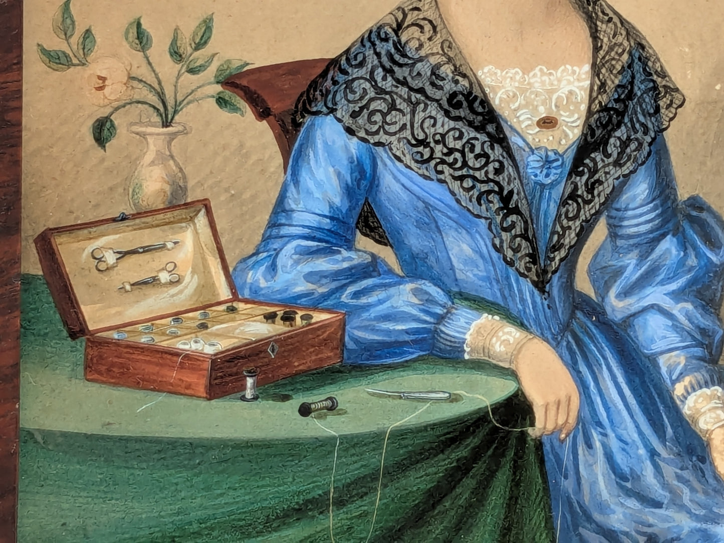 Antique portrait miniature of a lady with her workbox