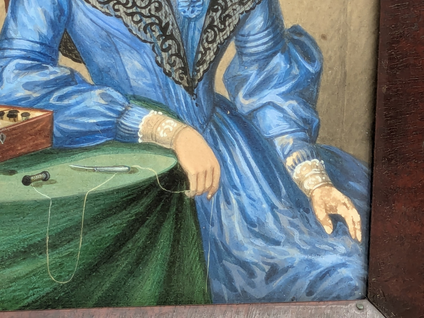 Antique portrait miniature of a lady with her workbox