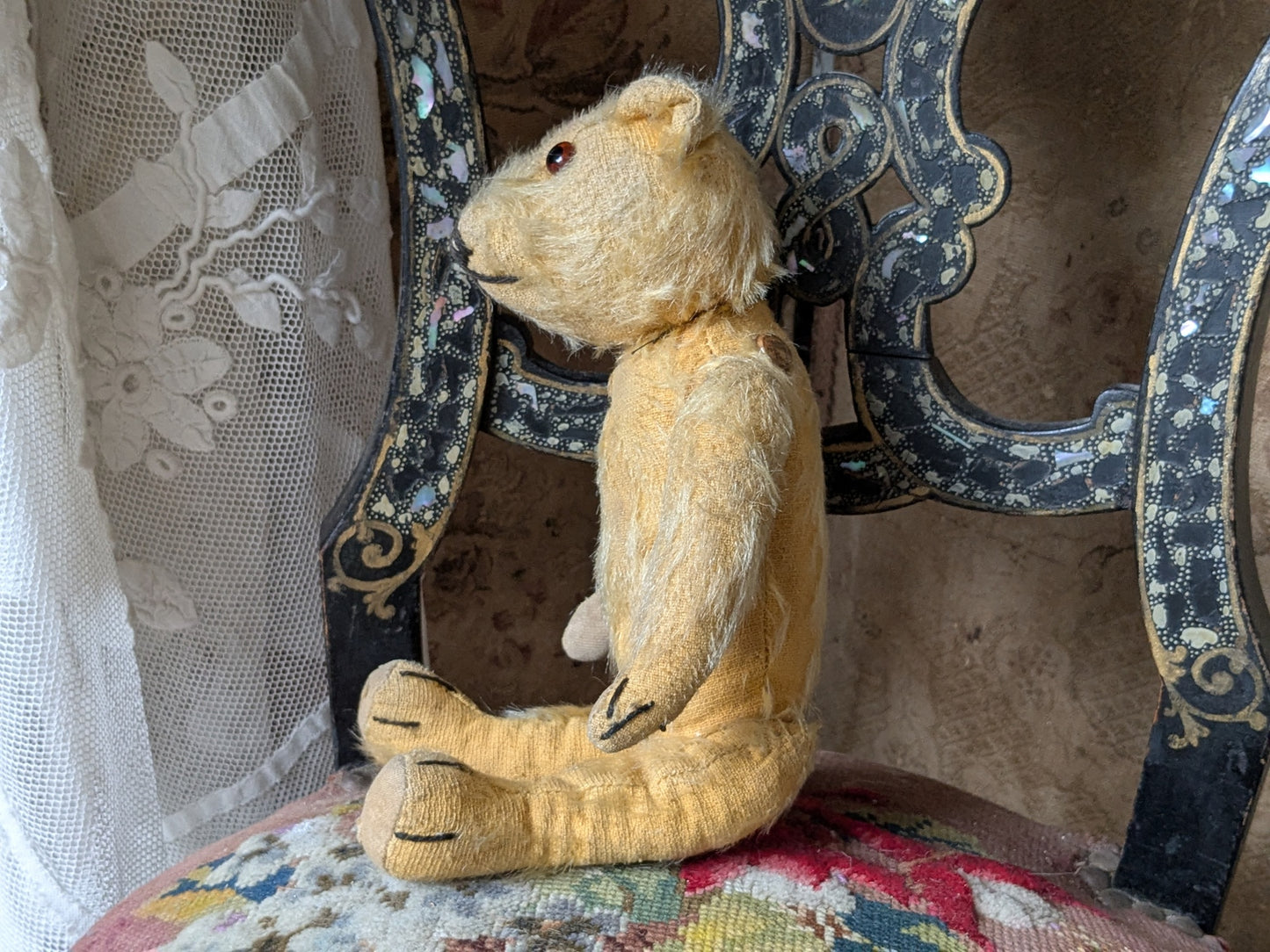 Small vintage Merrythought bear in charming clothes