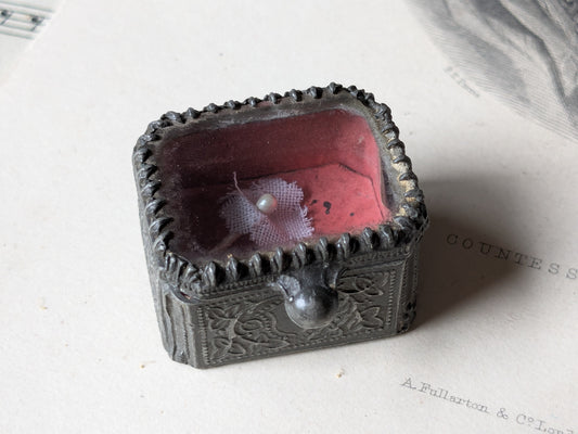 Miniature glass casket for a dolls house