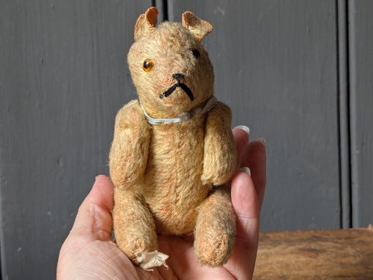 Tiny vintage teddy bear