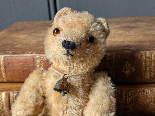Tiny vintage teddy bear